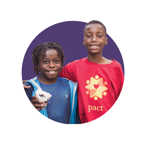two black children smiling in purple circle